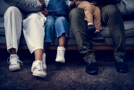 Closeup of family sitting on the couch