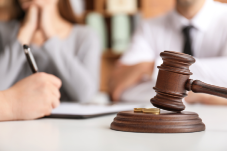 Judge gavel on table in lawyer's office. Concept of divorce