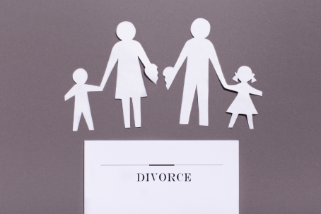 Dysfunctional family, divorce parent broken home concept. Paper cut out figures of broken family with children on gray
