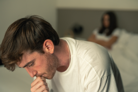Frustrated couple, headache and bed with stress for conflict, disagreement or argument in home. Upset, man and woman with guilt, fight or dispute in bedroom for cheating affair, mistake or divorce